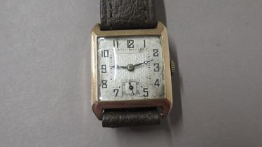 ROTARY. Gold case, silver dial. Sub seconds. 26mm. Brown leather strap. Good working order