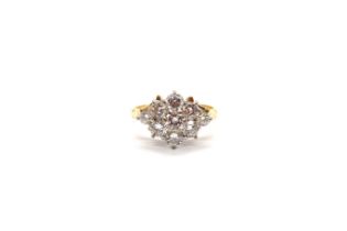 An 18ct (hallmarked) yellow gold diamond cluster ring set with nine round brilliant cut diamonds -
