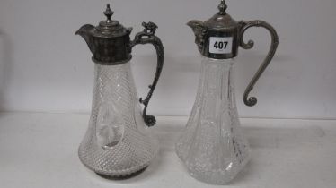 Two claret jugs with silver plated top