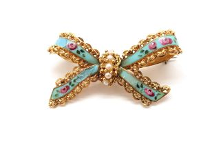 An 18ct yellow gold (hallmarked) and enamel brooch in the shape of a bow set with seed pearls - some