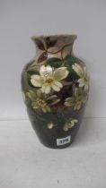 A Burmantofts fatience vase decorated with flowers, 24cm