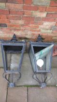 A pair of 19th century style lamp post tops - one piece of glass broken in one lamp