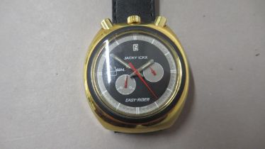 SORNA. Jack Ickx. Bullhead chrono. Early 70's. Gold case with black dial. 37mm. Jacky Ickx sinature.