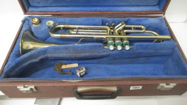 Three instruments: A Yamaha flute; a Rosetti clarinet; and a Khart trumpet, all cased