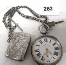 A silver double cased open face pocket watch - 5cm diameter (working in the saleroom) with key and