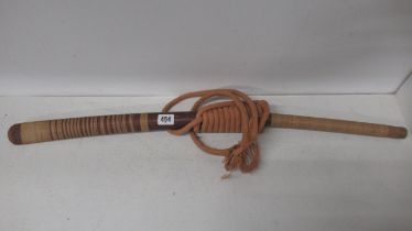 A Burmese DHA sword wooden handle with copper hilt and rope bound wood scabbard, curved steal blade,