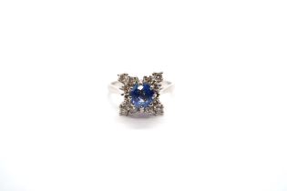 A platinum bespoke hand made sapphire and diamond ring - diamonds bright and lively - head size