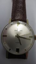 A gents Swissam manual wind watch on brown leather strap - working in the saleroom - case size 34mm