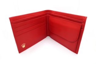 A red leather Rolex wallet - in good condition