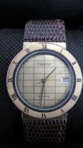 A Tissot quartz gold face watch with date on brown leather strap - 30mm face - working in the