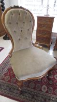 A 19th century mahogany nursing chair, nicely upholstered, in good condition