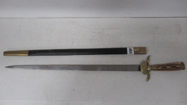 A 19th century German hunting sword with antler grip and brass mounts and etched blade, 49cm, in