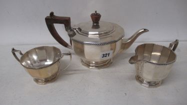 A Mappin and Webb cast silver three piece tea set - Tea pot, cream jug and sugar bowl - tea pot 25cm