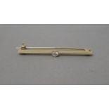 A 9ct (hallmarked) yellow gold and diamond bar brooch - 4cm - 2.2 grams