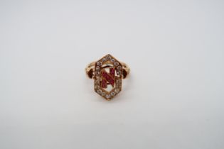 An approx 18ct (tested) yellow gold diamond and ruby ring - the head with open work as initials '
