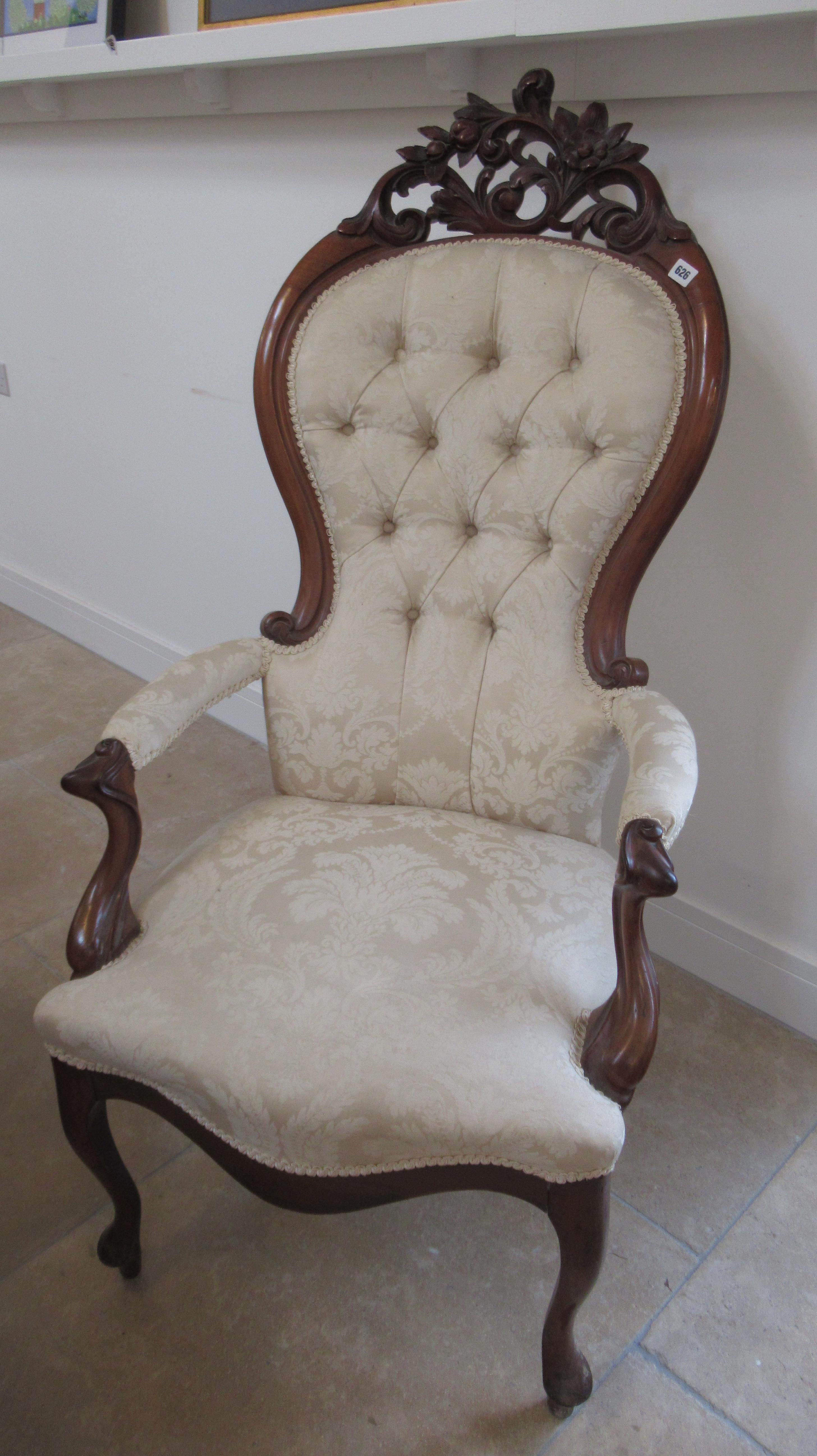 A Victorian style spoon back armchair - in good condition