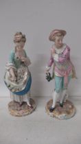 A pair of Continental porcelain figures of a Gallant & Lady - Meissen crossed swords mark to