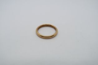 A hallmarked 22ct yellow gold wedding band, size T, approx 6.5 grams