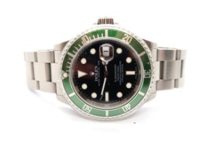 A Rolex Submariner 16610LV Kermit 2009 serial number V 185736 with box, papers and swing tag - in