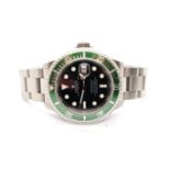 A Rolex Submariner 16610LV Kermit 2009 serial number V 185736 with box, papers and swing tag - in