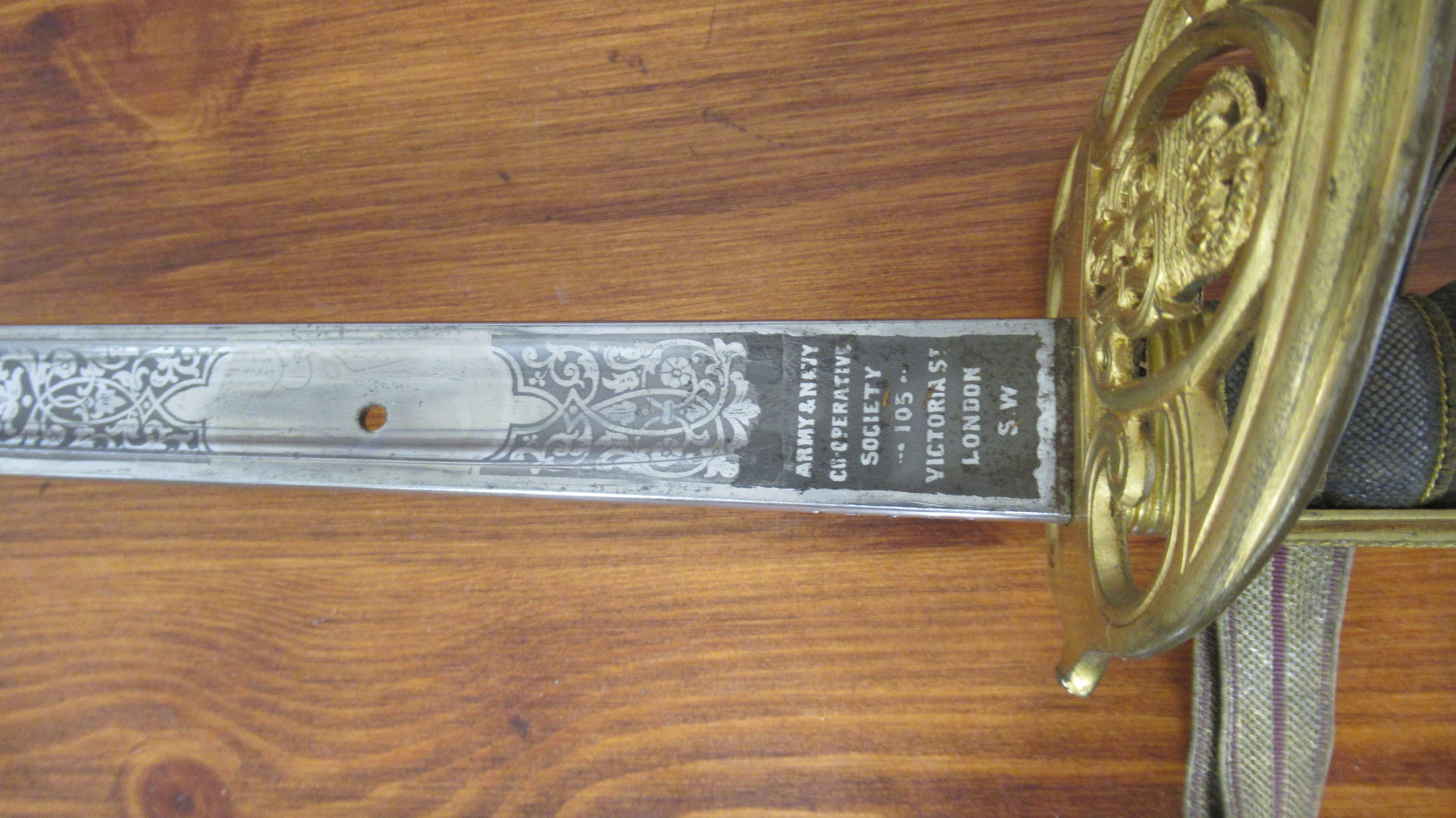 A WWI officers dress sword, gilt hand guard with GRV cypher, 82cm blade, marked 'Army & Navy Co- - Image 3 of 4