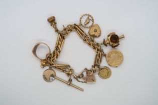 A hallmarked 9ct yellow gold charm bracelet with 11 charms, approx 58.5 grams