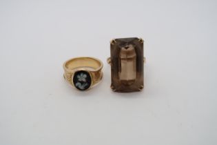 Two gold rings: 9ct hallmarked and smokey quartz ring, size N/O and an onyx cameo (damaged) ring,