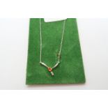 An 18ct white gold orange sapphire and diamond pendant - ex jewellers stock, as new condition -