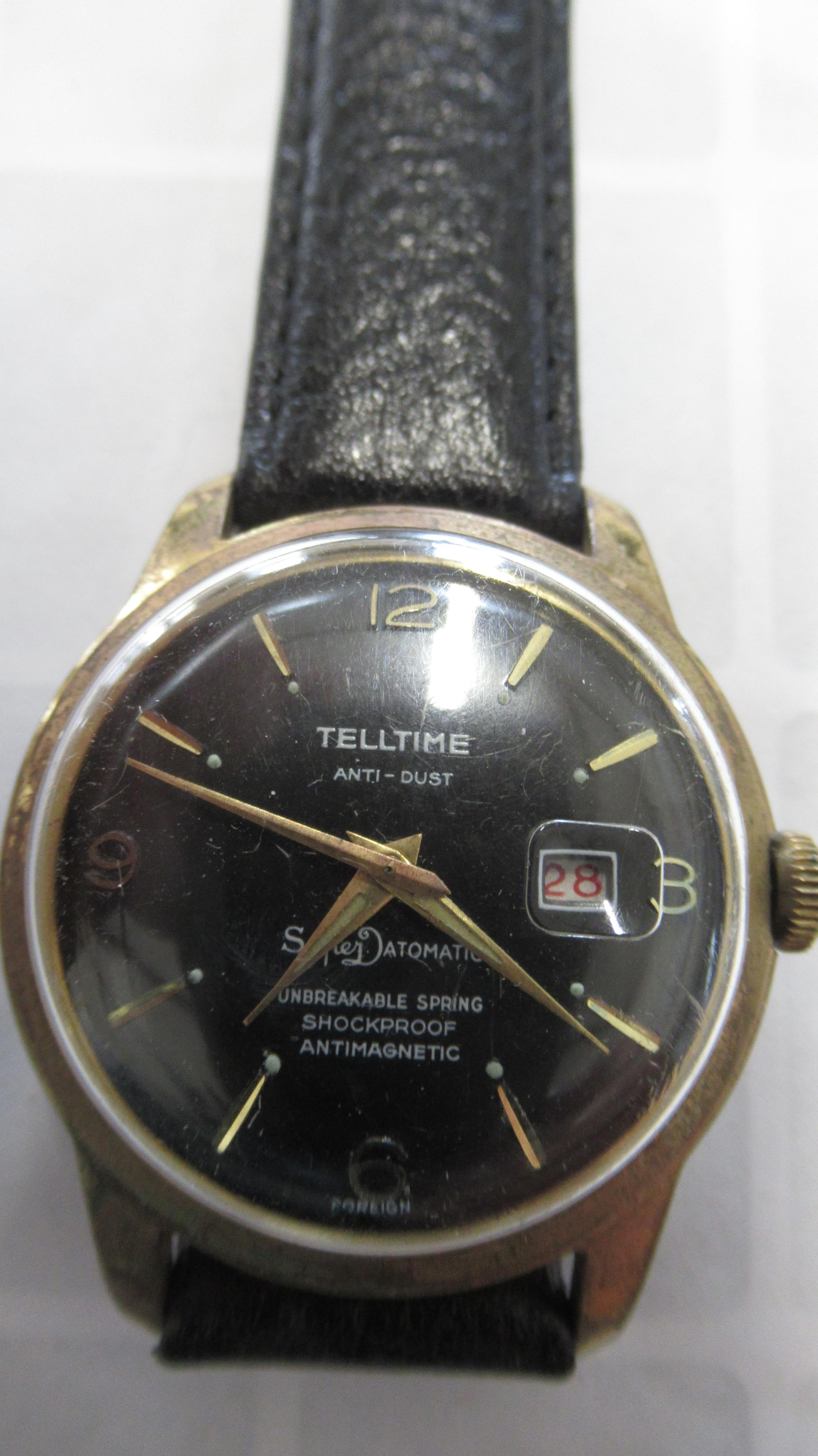 A gents Telltime auto with date on black leather strap - working in the saleroom - case size 35mm