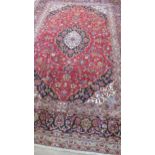 A hand knotted woollen Kashan rug - 3.56m x 2.37m