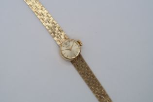 A ladies Rolex Orchid 18ct yellow gold bracelet watch, round case 15mm, approx 27 grams, with box,