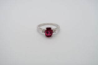 An 18ct white gold red tourmalline (rubellite) and diamond ring, rubellite is a very intense colour,
