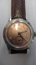 A Doxa Eldale with second hand on brown leather strap - working in the saleroom - case size 30mm