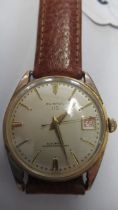 A gents Clinton auto with date and seconds on brown leather strap - working in the saleroom - case