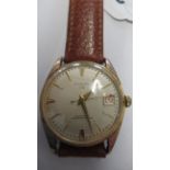 A gents Clinton auto with date and seconds on brown leather strap - working in the saleroom - case