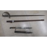 A sword and scabbard and a bayonet