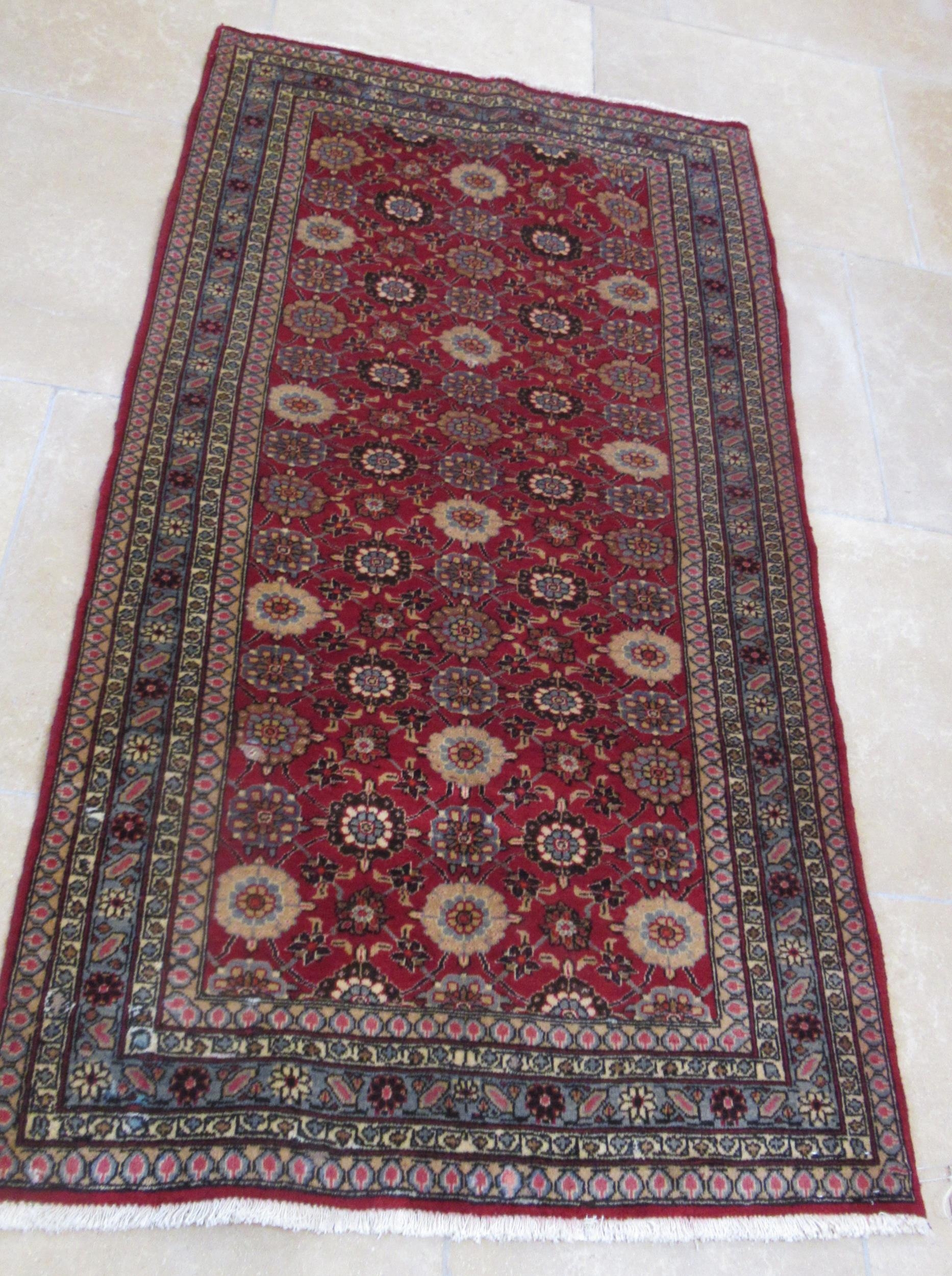 A hand knotted woollen Veramin rug - 1.94m x 1.00m