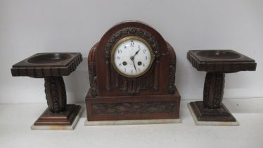 A French Art Deco style walnut and clock garniture, 8 day movement, stamped Horlogerie, Paris, set