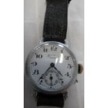 A ladies watch, with seconds on black leather strap - working in the saleroom - case size 28mm