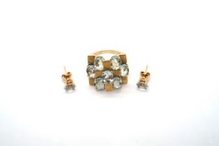 A contemporary designer 18ct yellow gold bespoke hand made aquamarine ring and a pair of