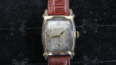 A Bulova wristwatch on a leather strap, not working