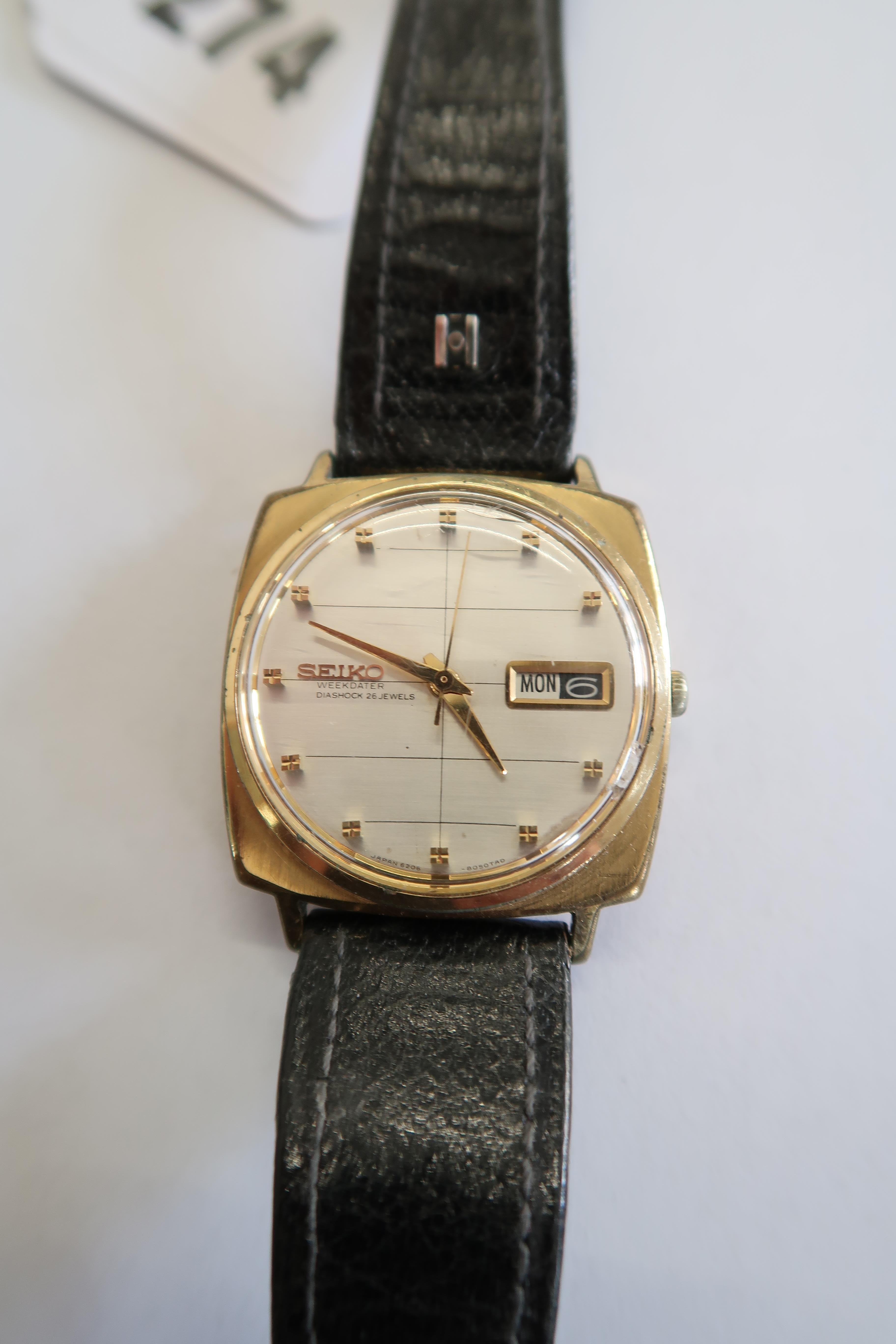 A Seiko Gents wristwatch on a leather strap, working in saleroom