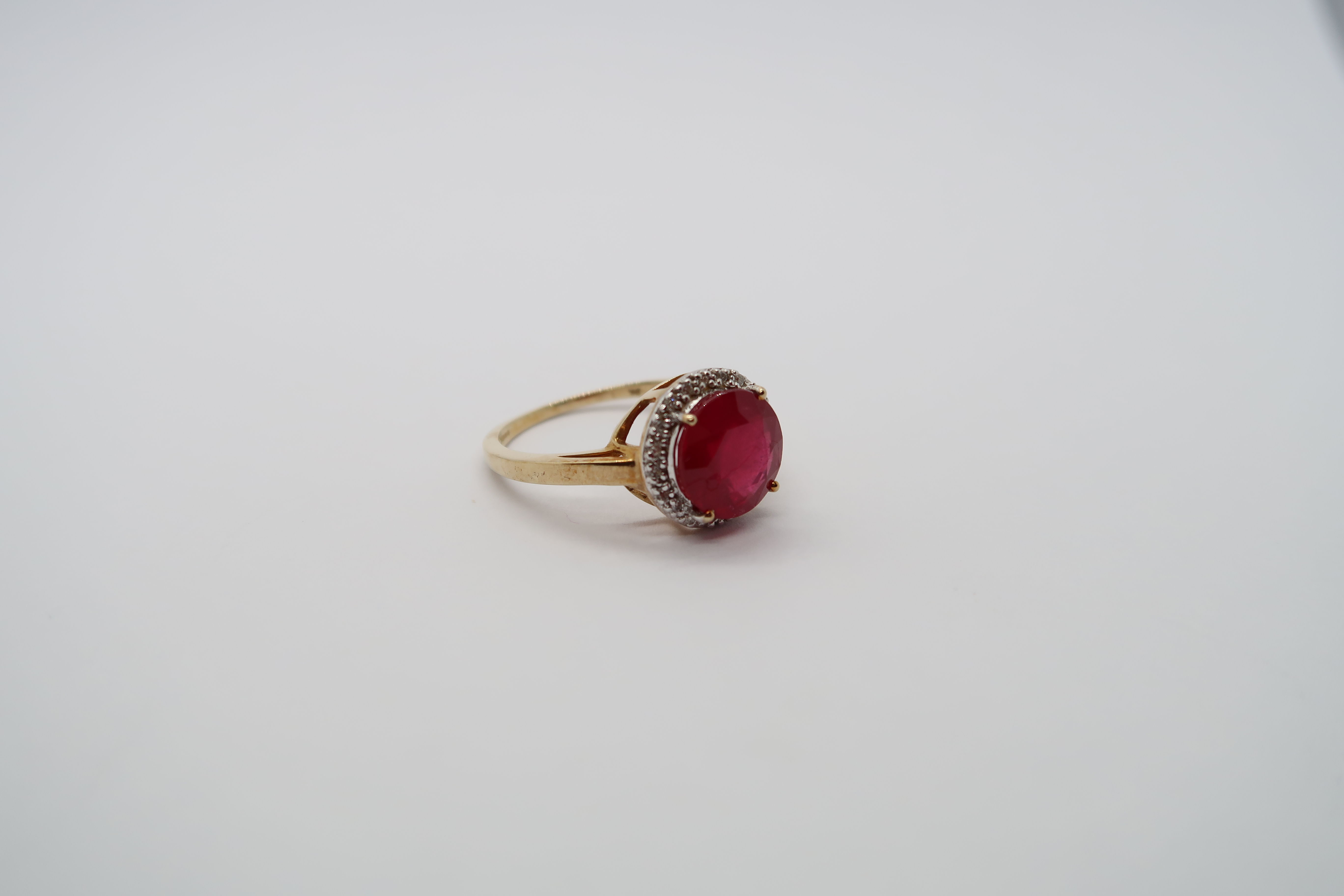 A 9ct yellow gold ruby and diamond ring, head size 12mm diameter, ring size N/O - Image 2 of 3