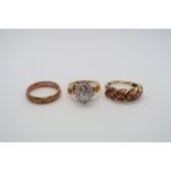 Three gold rings - An 8ct carved band, 3 grams, size N/O - A 9ct garnet ring, 3 grams, size N/O