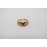 An 18ct (hallmarked) yellow gold ring set with single sapphire - ring size R - weight approx 4.8