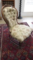 A 19th century mahogany nursing chair, nicely upholstered, in good condition