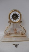 A 19th century French alabaster swinging cherub mantel clock, 30cm high x 13cm wide, recently