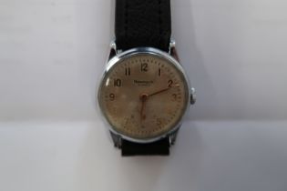 A gents Newark auto watch on black leather strap - working in the saleroom - case size 32mm