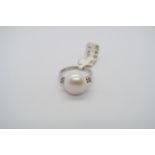 A 9ct white gold pearl and diamond ring size O - ex jewellers stock, as new condition - RRP £420