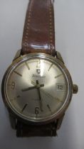 A gents Nivada manual watch with date and seconds on brown leather strap - working in the saleroom -